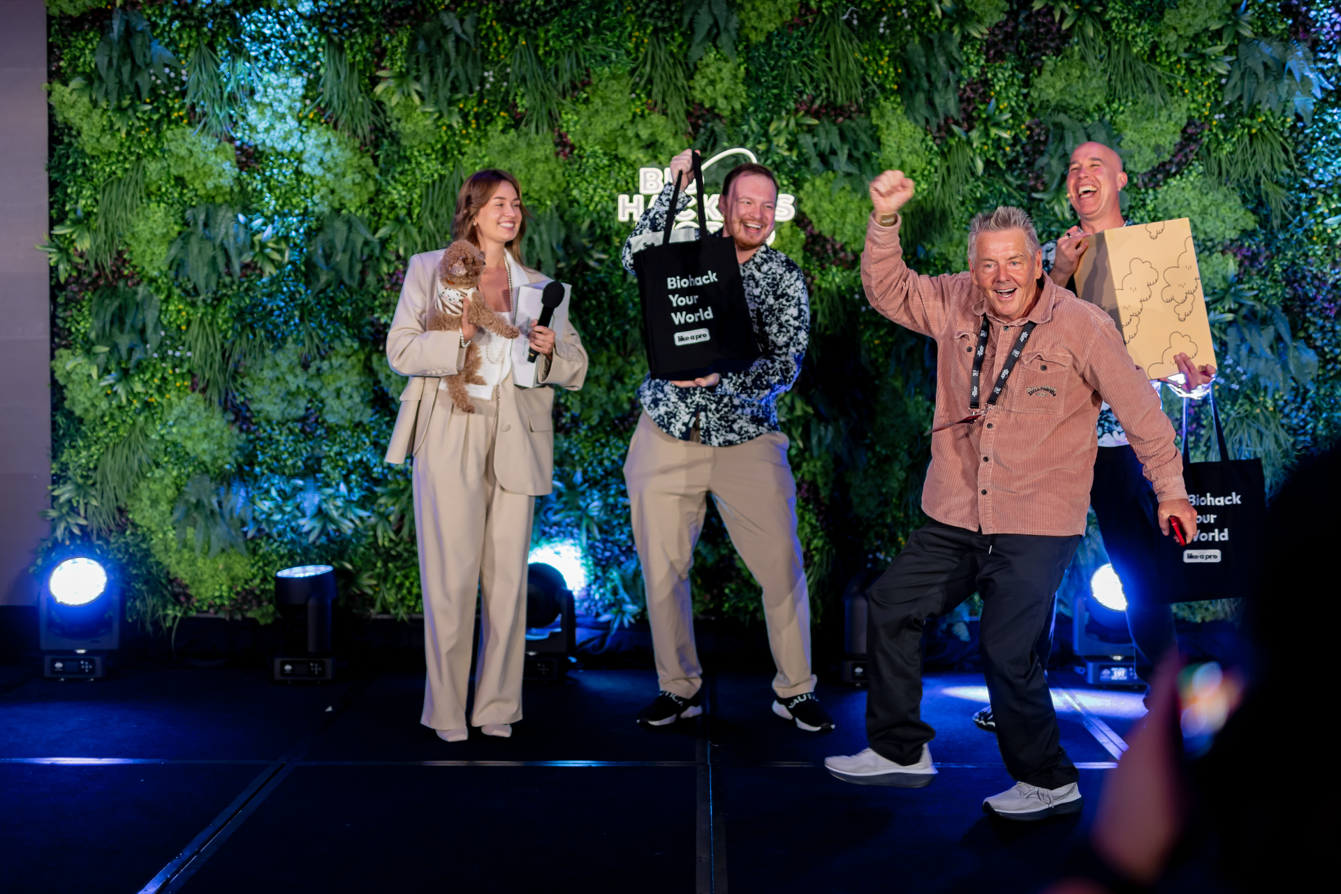 The Grand Giveaway — speakers raffling gifts to a cheering audience on stage